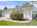 House exterior with front door and landscaping at 177 S Polk Ave, Louisville, CO 80027