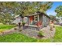 Updated bungalow with a stone patio and landscaping at 1408 6Th Ave, Longmont, CO 80501