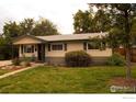 Nice ranch home with a well-maintained lawn and walkway at 6213 Gray St, Arvada, CO 80003