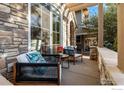 Cozy patio with wicker chairs and a pergola at 3766 Ridgeway St, Boulder, CO 80301