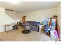 Spacious living room with sofa and ample floor space at 8047 Wolff St # F, Westminster, CO 80031