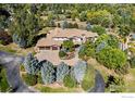Luxury home with circular driveway and mature trees at 8001 Fairview Rd, Boulder, CO 80303