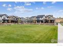 Community green space with homes showcasing a consistent architectural style at 125 Mesa Way, Superior, CO 80027