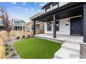 Charming home exterior with a manicured lawn, artificial turf, and walkway at 125 Mesa Way, Superior, CO 80027