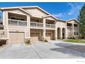 Three-unit townhome building with attached garages and balconies at 2931 Whitetail Cir # 2931, Lafayette, CO 80026
