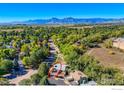 Aerial view of a home with a deck, and mountain views at 4631 Portside Way, Boulder, CO 80301