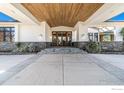 Elegant home entrance with wooden doors at 8532 Strawberry Ln, Niwot, CO 80503