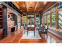 Spacious home office with built-in shelves and hardwood floors at 8532 Strawberry Ln, Niwot, CO 80503
