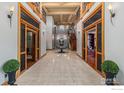 Grand foyer with tile floors and staircase at 8532 Strawberry Ln, Niwot, CO 80503