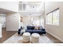 Open living room with high ceilings and loft view at 6158 Habitat Dr, Boulder, CO 80301