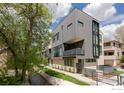 Modern three-story building, gray siding, located by a stream at 1831 22Nd St # 2, Boulder, CO 80302