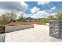 Spacious rooftop deck with mountain views and privacy screen at 1831 22Nd St # 2, Boulder, CO 80302