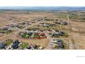 Aerial view of a house and surrounding neighborhood, showcasing the property's location and landscape at 3318 Tranquility Way, Berthoud, CO 80513