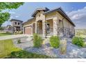 Tan one-story house with stone accents and landscaping at 365 Casalon Pl, Superior, CO 80027