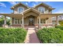 Two-story home with a covered porch and walkway at 920 Sunny Way, Lafayette, CO 80026