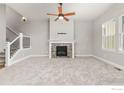 Spacious living room with fireplace and carpet at 1540 Stoneseed St, Berthoud, CO 80513