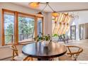 Bright dining area with a round table and view to backyard at 225 Bristlecone Way, Boulder, CO 80304