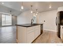 Modern kitchen with island and stainless steel appliances at 235 High Point Dr # 205, Longmont, CO 80504