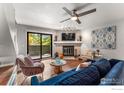 Spacious living room with fireplace and comfortable seating at 3785 Birchwood Dr # 72, Boulder, CO 80304