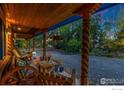 Inviting porch with wooden columns, comfortable seating, and a view of the driveway at 1600 17Th Ave, Longmont, CO 80501