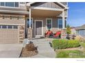 Covered porch with welcoming seating at 514 Mount Rainier St, Berthoud, CO 80513