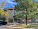 Building exterior with landscaping and parking area at 3345 Chisholm Trl # 105C, Boulder, CO 80301