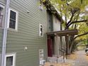 Exterior view of building showing entrance and landscaping at 3345 Chisholm Trl # 105C, Boulder, CO 80301