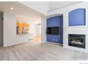 Spacious living room with fireplace and open kitchen at 236 Remuda Ln, Lafayette, CO 80026