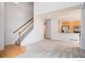Open concept kitchen with stainless steel appliances and light wood cabinets at 236 Remuda Ln, Lafayette, CO 80026