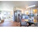 Modern kitchen with stainless steel appliances and breakfast nook at 807 Busch St, Longmont, CO 80501