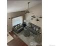 Living room with gray sofas and a coffee table at 9772 W 82Nd Pl, Arvada, CO 80005