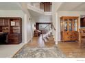 Two story entryway with hardwood floors at 3351 Graylock Run, Broomfield, CO 80023