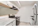 Modern kitchen with stainless steel appliances and white cabinetry at 2707 Valmont Rd # 110B, Boulder, CO 80304