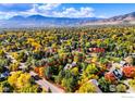 Aerial view showcasing a home's large lot and surrounding neighborhood with fall colors at 3737 26Th St, Boulder, CO 80304