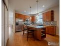 Modern kitchen with stainless steel appliances and an island at 321 Saint Ida Cir, Lafayette, CO 80026