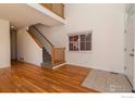 Bright living room with hardwood floors and a view of the staircase at 818 S Terry St # 85, Longmont, CO 80501