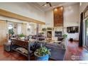 Open concept living room with a large sectional sofa and a stunning fireplace at 1919 3Rd Ave, Longmont, CO 80501