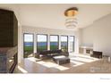 Open living space with modern furniture and a view of the outdoors at 2664 Southwind Rd, Berthoud, CO 80513