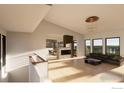 Bright and airy living room with a fireplace and large windows at 2664 Southwind Rd, Berthoud, CO 80513