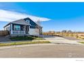 Ranch style home with a two-car garage and a view of the mountains at 13602 Topaz Pl, Mead, CO 80504