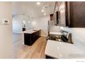 Modern kitchen with stainless steel appliances and white cabinets at 265 High Point Dr # 304, Longmont, CO 80504