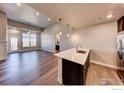 Spacious living room with hardwood floors and a view at 265 High Point Dr # 304, Longmont, CO 80504
