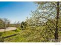 Landscaped grounds with curved walkway and distant mountain view at 985 Laramie Blvd # C, Boulder, CO 80304