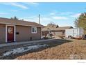 House exterior with a red door and a gravel pathway at 2981 W 144Th Ave, Broomfield, CO 80023