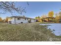 Spacious backyard with a gazebo and partially snow covered lawn at 3390 W 92Nd Pl, Westminster, CO 80031