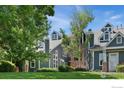 Gray townhome exterior with landscaping and a brick base at 11193 Alcott St # C, Westminster, CO 80234