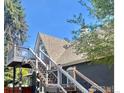 Elevated deck with stairs leading to backyard at 203 S 3Rd Ave, Brighton, CO 80601