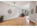 Light and airy living room with wood floors and fireplace at 7452 Singing Hills Dr, Boulder, CO 80301