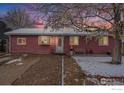 Cute ranch home with a snow covered yard at 907 Elm Ct, Fort Lupton, CO 80621