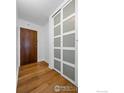 Entryway with wood floors, a coat closet, and a door at 1850 Folsom St # 611, Boulder, CO 80302